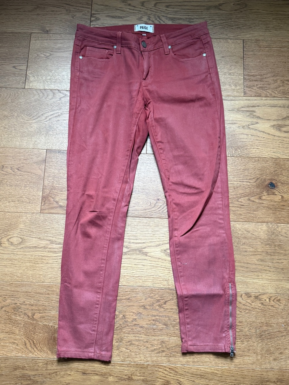Paige jeans, distinct red wash and functional ankle zippers.